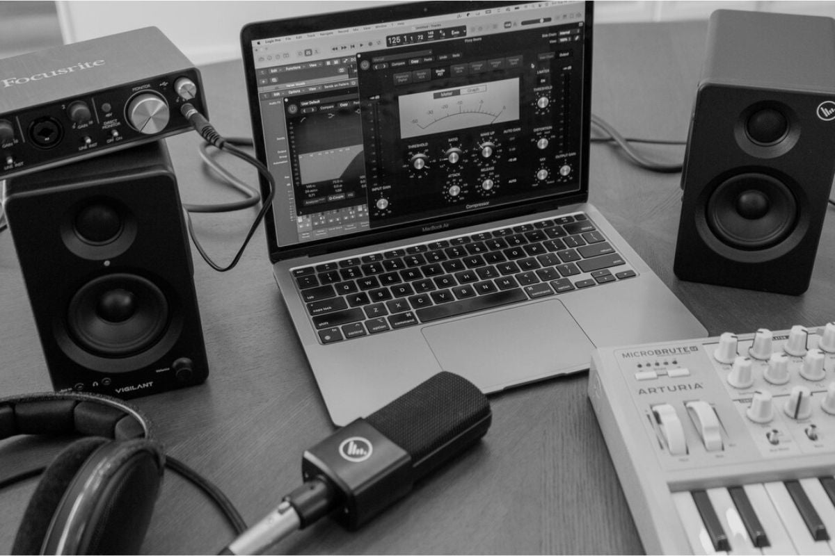 SwitchOne Speaker with a laptop as a project studio setup, incudes VA92 mic and arturia synth and macbook pro.